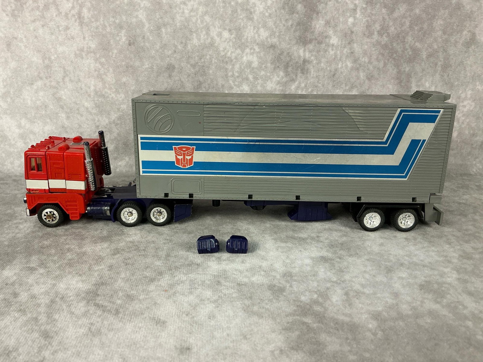 Optimus Prime Transformer: 1985 Transformers Optimus Prime generation one, marked Takara Co. Ltd Japan. Missing pieces, has wear from play. Trailer measures 2.75 inches wide x 9 x 4.25 inches tall.
