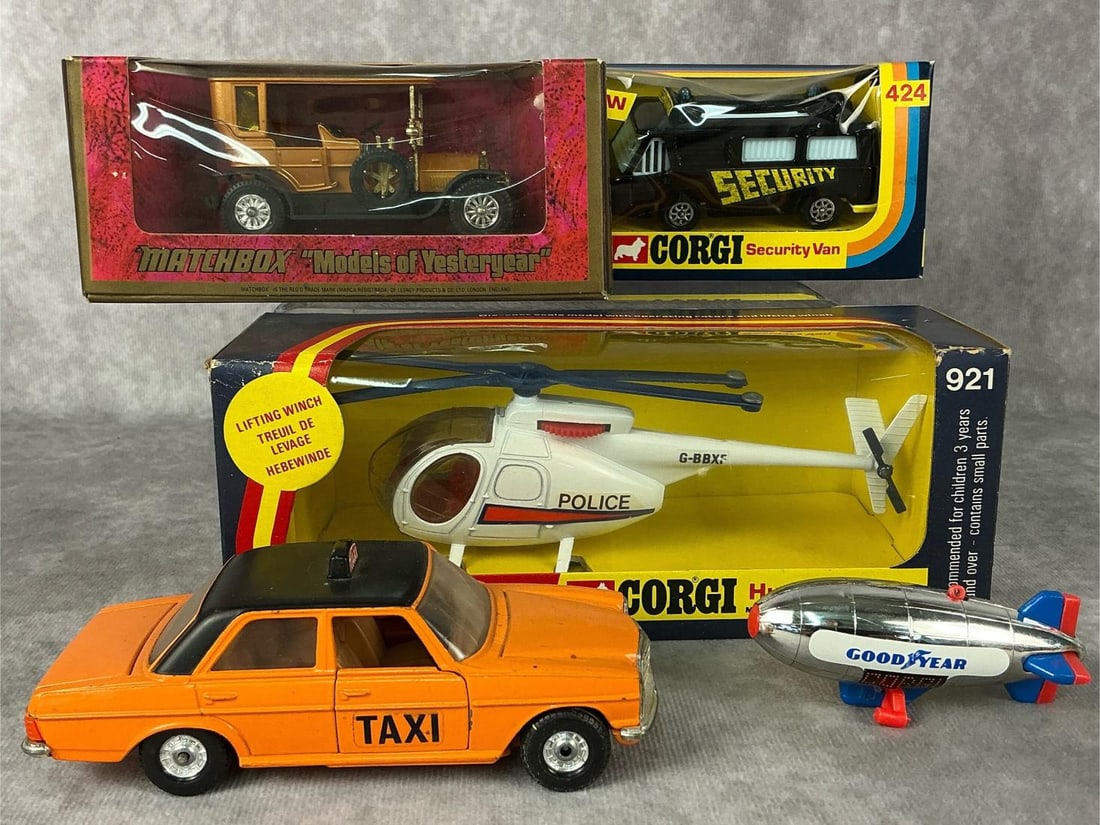 Corgi Cars & More: Five 1970s vehicles made by Corgie and Matchbox. 1974 Corgi Hughes 369 helicopter made in Hong Kong, 1976 Corgi Security Van made in Great Britain, Corgi Mercedes-Benz 240D Taxi made in Great
