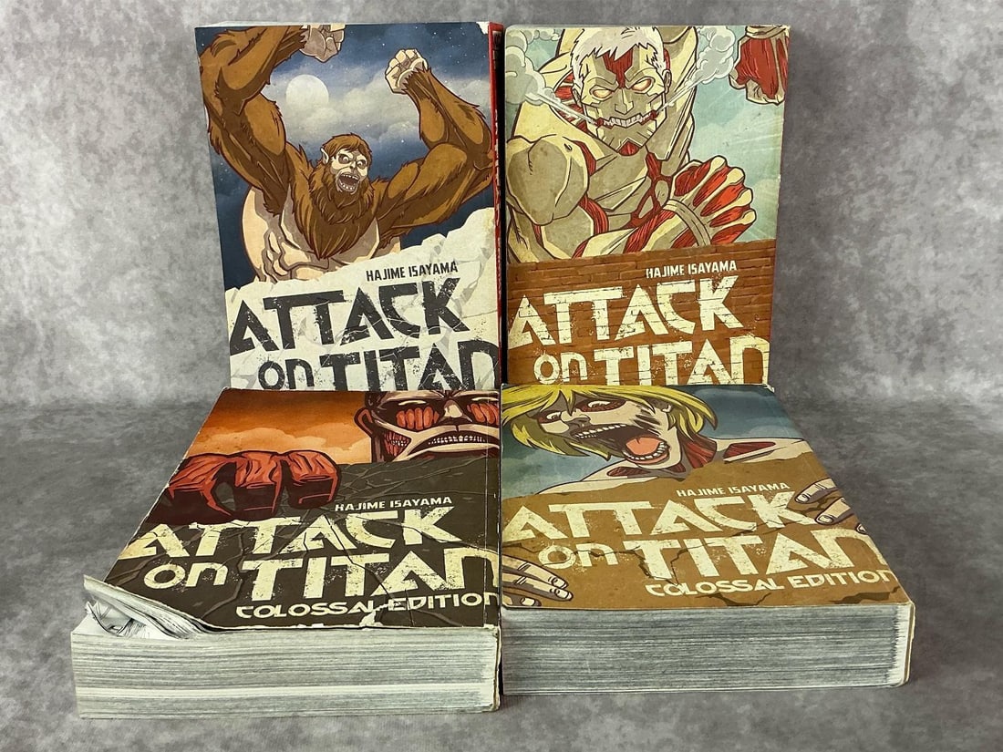 Attack On Titan Books: Four 2012-2016 Attack on Titan Colossal Edition books. Includes volumes one through twenty in four books. Fair to good condition with some covers having creases and bent pages. Each book measures 7