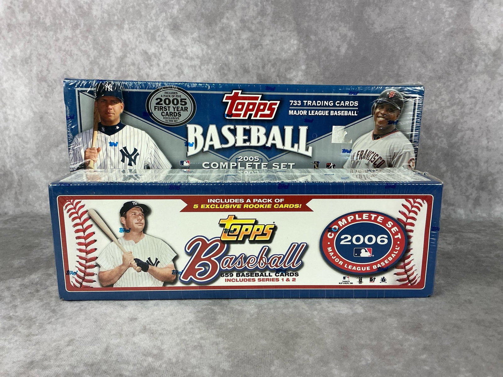 Topps Baseball Card Sets: 2005 and 2006 Topps complete sets of baseball cards sealed in original boxes. Good condition. Largest measures 13.25 inches wide x 2.75 x 4 inches tall.