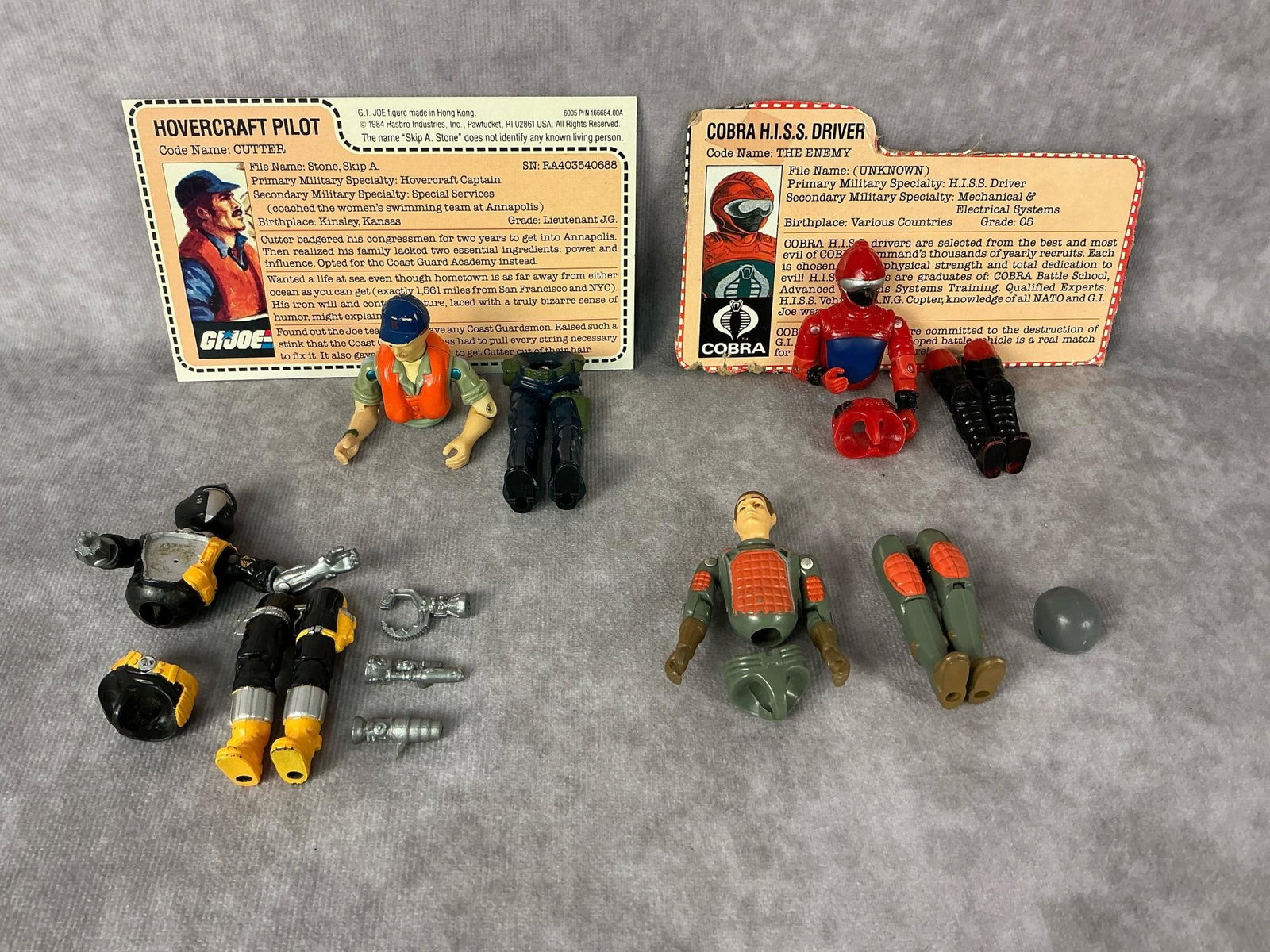 G.I. Joe Action Figures: 1982-1986 G.I. Joe action figures made by Hasbro in Hong Kong. 1982 Flash Laser Rifle Trooper, 1983 Cobra H.I.S.S Tank Driver with file card, 1984 Cutter Hovercraft Pilot with file card, and 1986