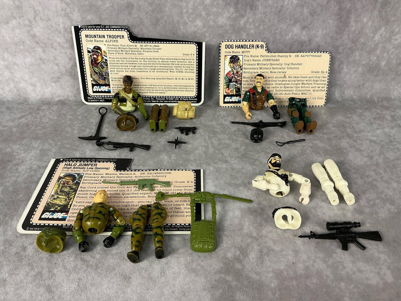 G.I. Joe Action Figures: 1984 and 1985 G.I. Joe action figures made by Hasbro in Hong Kong. 1984 Mutt the Dog Handler with file card and accessories, 1984 Rip Cord with file card and gun and pack, 1985 Alpine Mountain