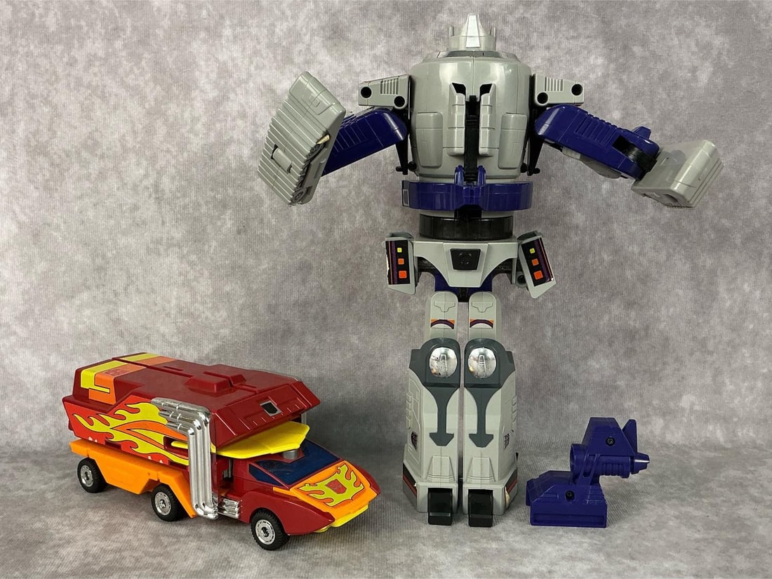 1980s Transformers: Two 1986 generation one Transformers made by Hasbro in Japan and Korea. Includes Autobot Rodimus Prime and Galvatron. Galvatron is in working condition, makes sounds and lights up. General play wear