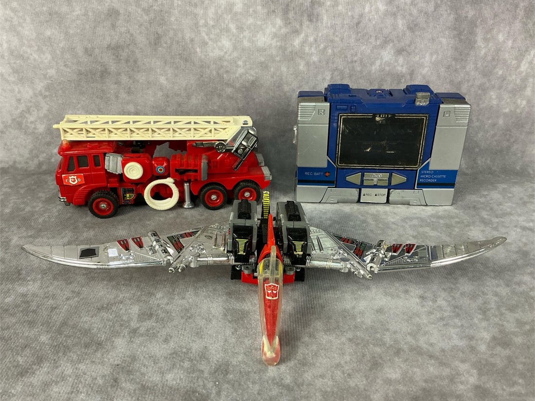 1980s Transformers: Three 1980s generation one Transformers includes Dinobot Swoop, Soundwave, and Inferno. All have general play wear and paint loss. Inferno measures 2.25 inches wide x 5.25 x 2 inches tall.
