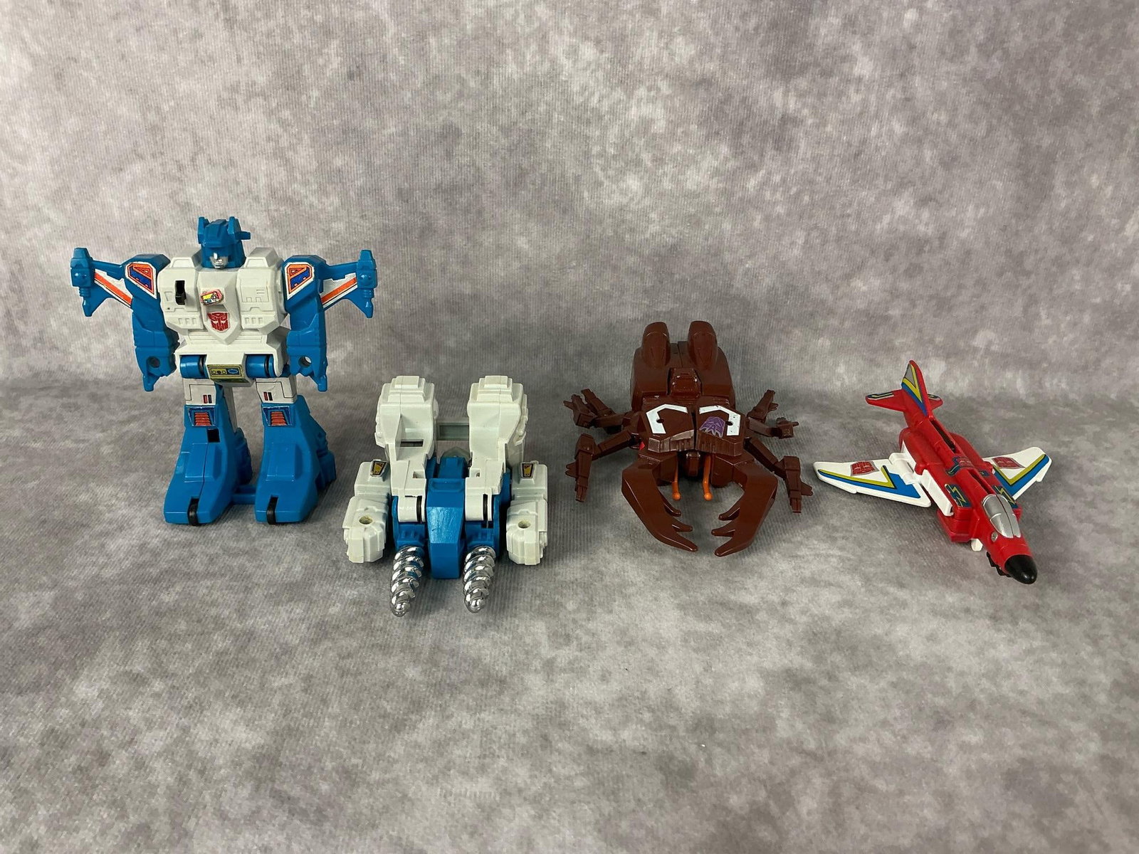 1980s Transformers: Four 1984 and 1985 generation one Transformers made by Takara, Bandai, and Hasbro in Japan and Taiwan. Includes Fireflight, Chop Shop, Topspin, and Twin Twist. All have minor play wear otherwise in