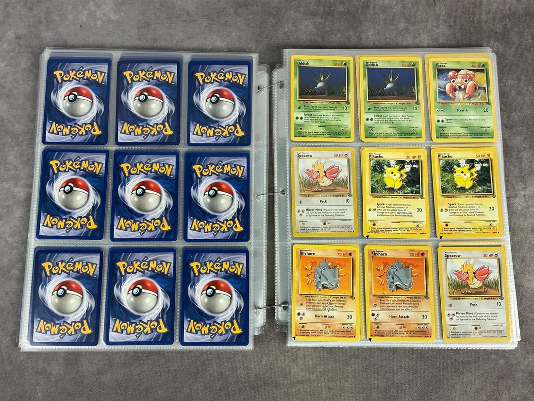 Pokemon Cards: Over 200 vintage Pokemon cards, mostly 1999 and 2000, a few modern cards. Includes Pokemon, Trainer, and Energy cards. Some cards are duplicates. Various conditions. Each sheet measures 8.75 inches wi