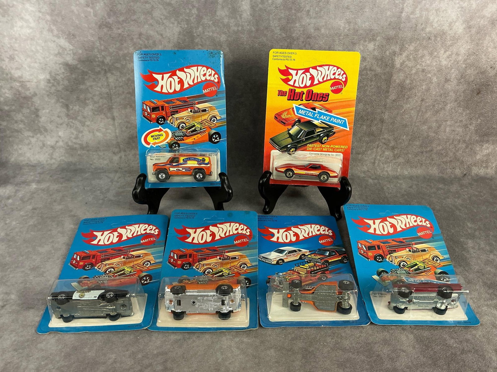Vintage Hot Wheels: Six 1982 Hot Wheels in original packaging, made by Mattel in Hong Kong. Includes Sheriff Patrol, Landlord, Dixie Challenger, ‘57 T-Bird, Baja Breaker, and a Corvette Stingray. All packaging has