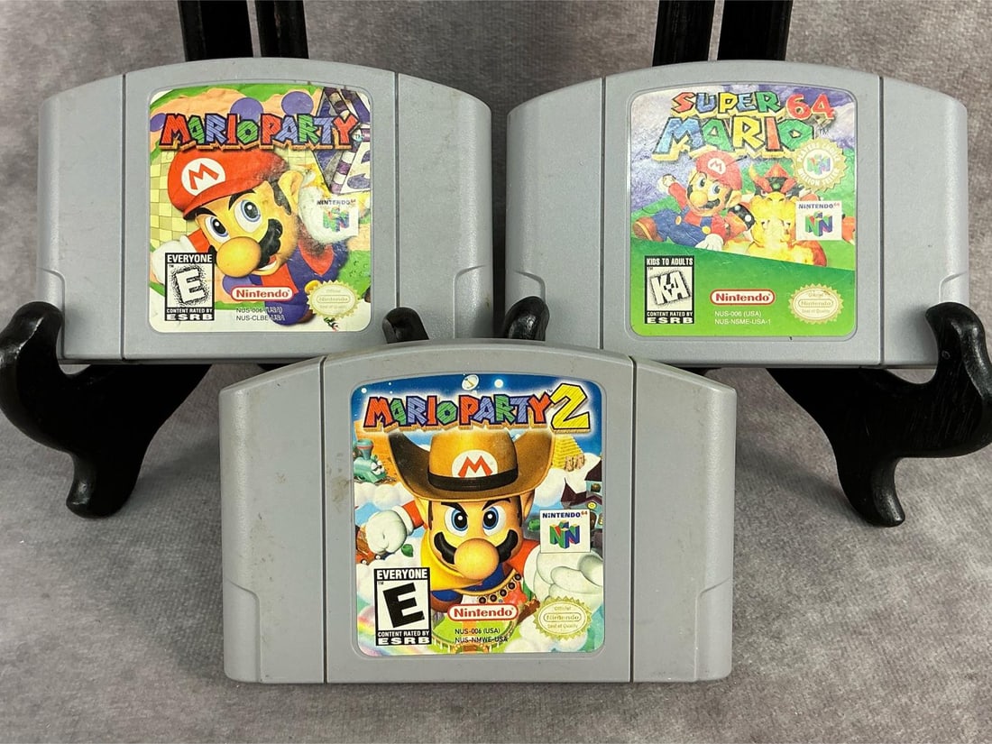 Nintendo 64 Games: Three vintage original Nintendo 64 games. Includes Super Mario 64, Mario Party, and Mario Party 2. All games are untested and have wear. Each one measures 4.5 inches wide x 3 inches tall.