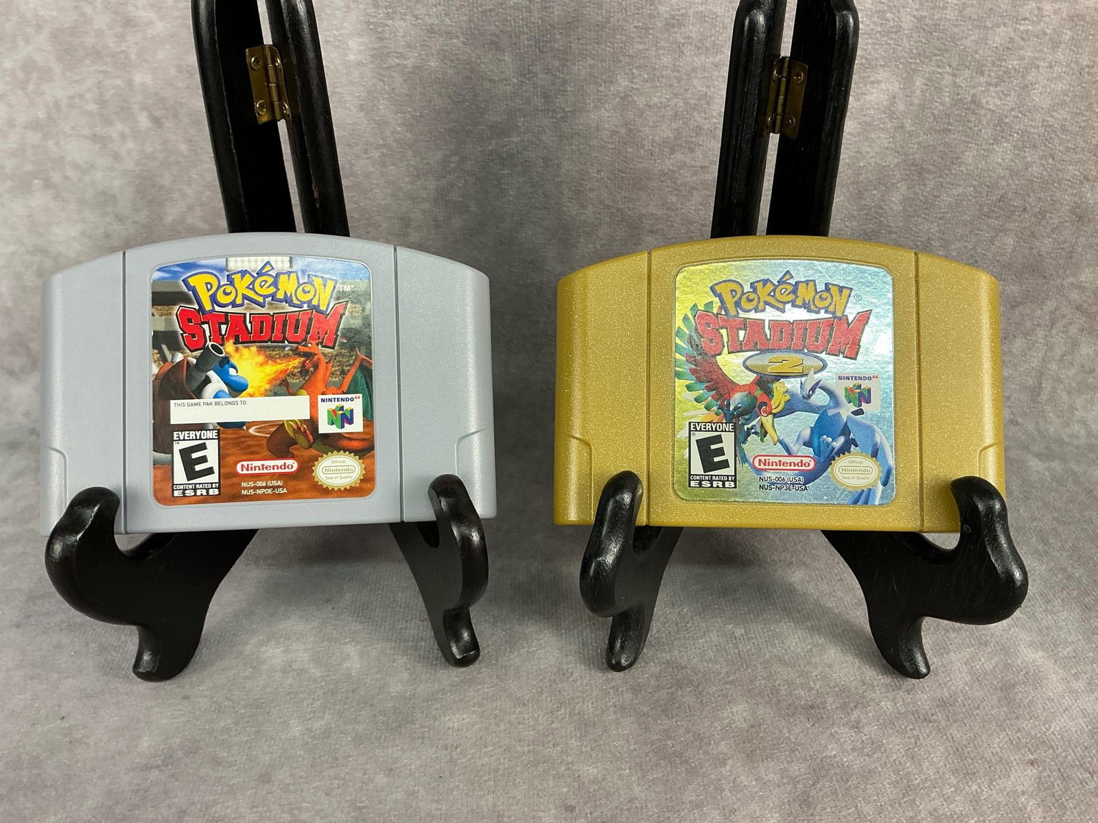Nintendo 64 Games: Two vintage original Nintendo 64 games. Includes Pokemon Stadium and Pokemon Stadium 2. Both games are untested but in good condition. Each one measures 4.5 inches wide x 3 inches tall.