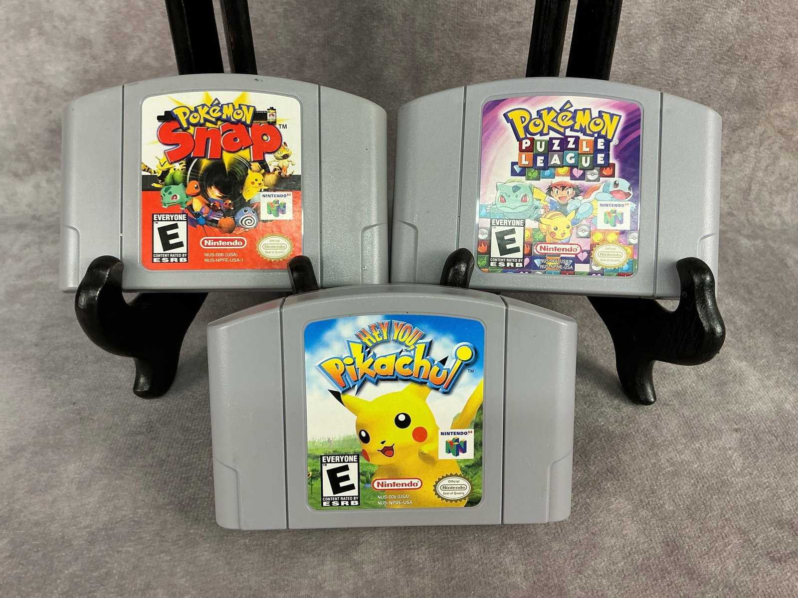 Nintendo 64 Games: Three vintage original Nintendo 64 games. Includes Pokemon Snap, Pokemon Puzzle League, and Hey You Pikachu!. All games are untested but are in good condition. Each one measures 4.5 inches wide x 3 in