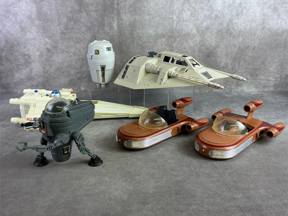 Star Wars Toy Vehicles: Six Star Wars toy vehicles including 1978 X Wing, 1978 Landspeeder, 1980 Rebel Snowspeeder, 1982 CAP 2 captivator, and part of the Land of the Jawas set. All in fair condition with all missing