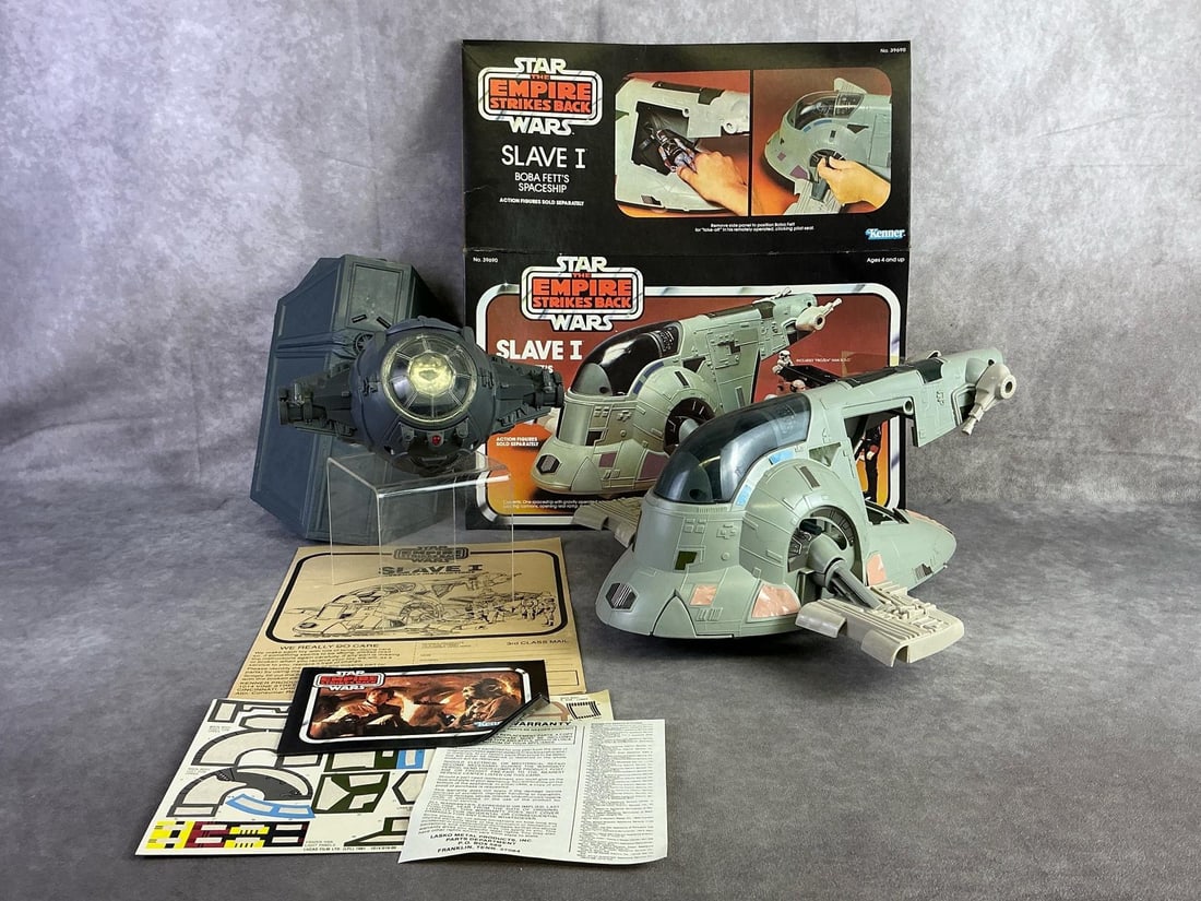 Star Wars Vehicles: Two Star Wars toy vehicles including 1981 Slave I and 1983 Tie Interceptor. Both in fair used condition with both missing parts although Slave I includes original box and instructions. Slave I