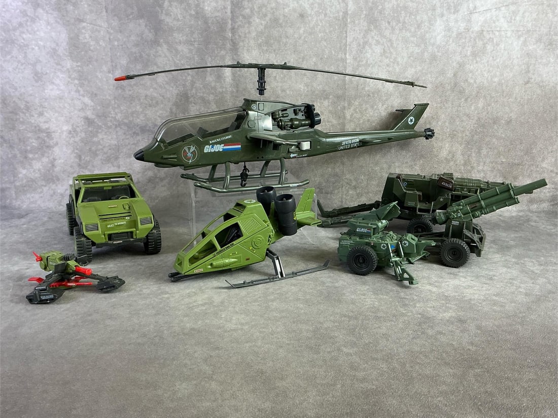 GI Joe Vehicles: Three GI Joe vehicles including 1982 Arah VAMP Jeep, 1983 Dragonfly XH1 assault helicopter, and 1984 Sky Hawk VTOL. Four additional accessories from different playsets of the 1980s. All in fair used c