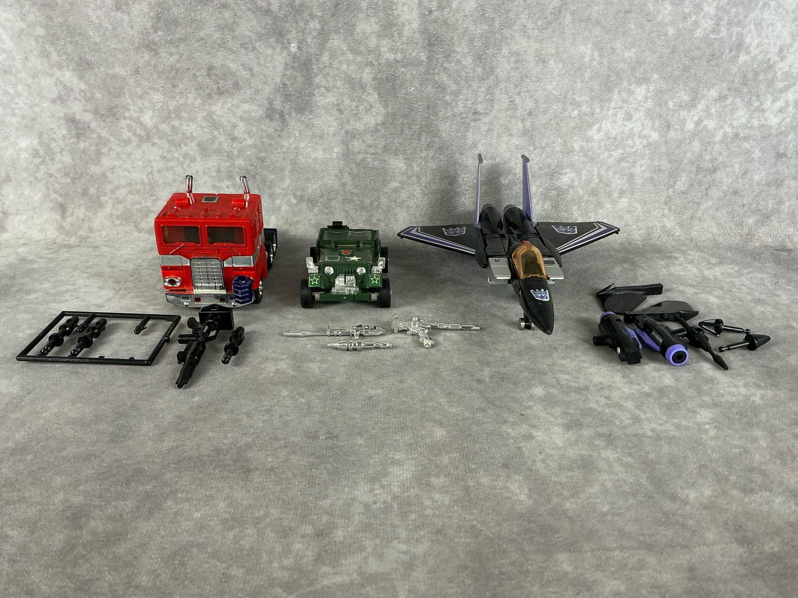 Transformers: Three 1980’s transformers made by Takara Co in Japan. Includes Optimus Prime, Hound, and Skywarp. All include some accessories but not complete. Good condition. Skywarp measures 5.75 inches wide x 7