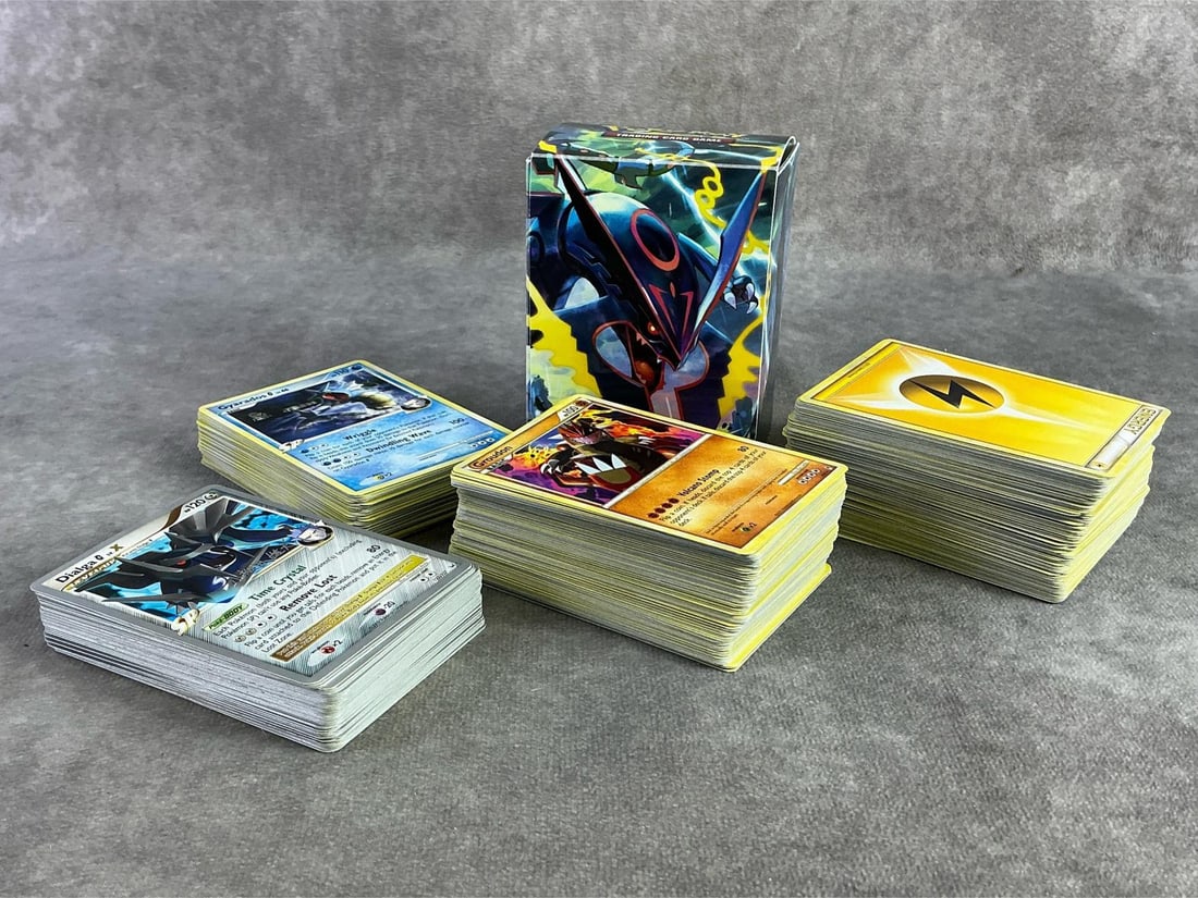 Pokemon Cards: Large lot of Pokemon cards from mid 2000s and World Champions 2010. Includes Basic, Stage one, Trainer and Supporter. All appear in fair to good condition and each measures 2.5 inches wide x 3.25