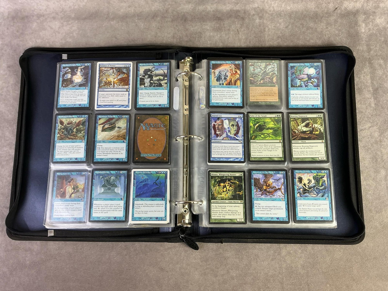 Magic The Gathering: Binder of approximately 180, 1993 Magic the Gathering Deckmaster cards. All in good condition and with protective sleeve. Each measures 2.5 inches wide x 3.25 inches tall.