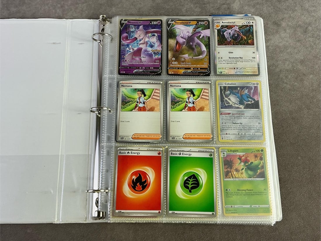 Pokemon Cards: Binder of approximately 170 Pokemon cards from the 2020s. Includes Basic, Stage one, Trainer and Supporter. All appear in good condition and each measures 2.5 inches wide x 3.25 inches tall.