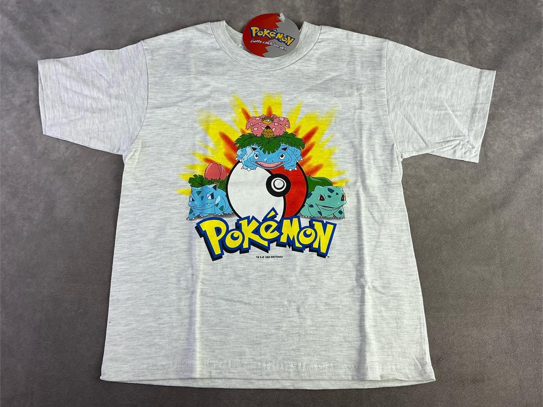 1999 Pokemon Kids Shirt: 1999 Nintendo Pokemon kids shirt. In good condition with original tag. Shirt is a kids size large. Pit to pit measurement is 15 inches.