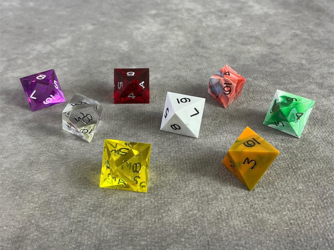 D8 Dice: Eight vintage D8 dice in a variety of colors. Each are eight sided and commonly used in role play games. Each approximately measure 1 inch.