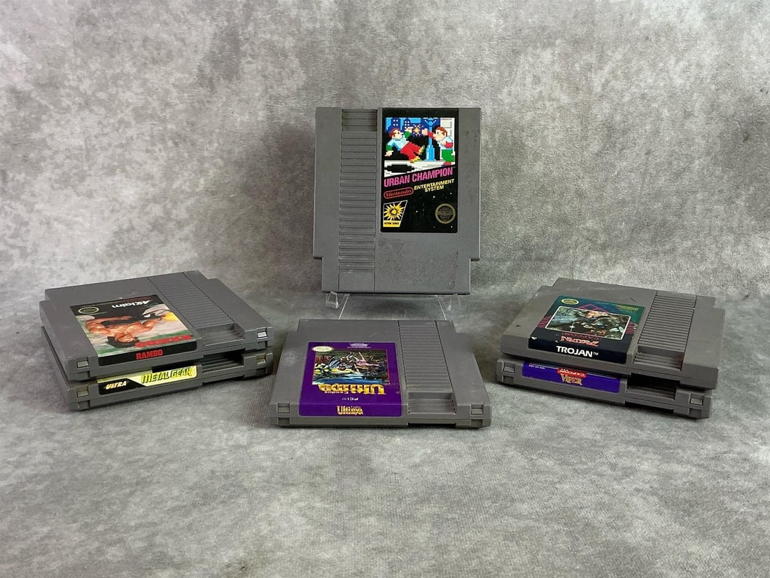 NES Games: Six vintage NES Nintendo Entertainment System Games including Rambo, Urban Champion, Metal Gear, and more. All in good untested condition. Each measures 4.65 inches wide x 5.25 inches tall.