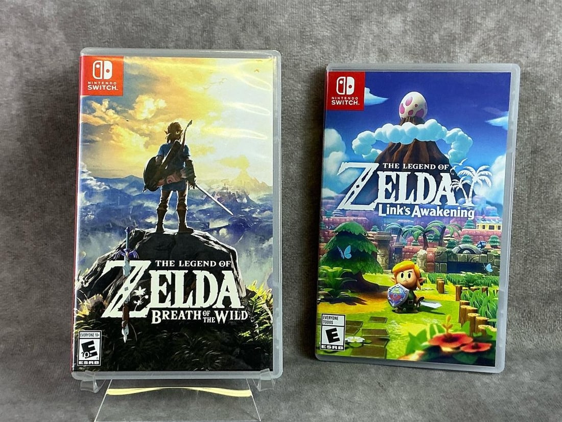 Nintendo Switch Games: Two Nintendo Switch games including Zelda Breath of the Wild and Zelda Links Awakening. All in good untested condition. Each measures 4 inches wide x 6.5 inches tall.