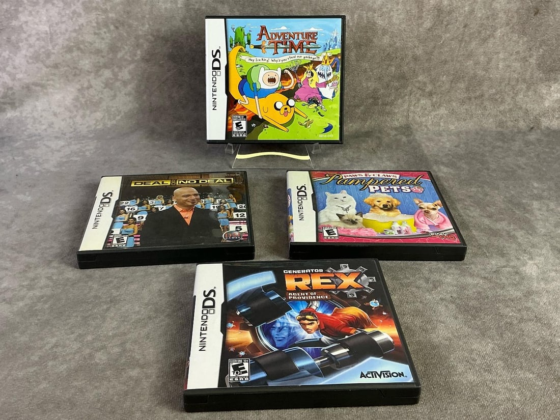 Nintendo DS Games: Four Nintendo DS games including Adventure Time, Deal or No Deal, Pampered Pets, and Generator Rex. All in good untested condition. Each measures 5.25 inches wide x 4.75 inches tall.