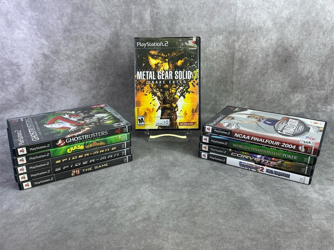 Playstation 2 Games: Ten vintage PlayStation 2 games including Metal Gear Solid 3, Ghostbusters, NCAA, and more. All in good untested condition. Each measures 5.25 inches wide x 7.5 inches tall.