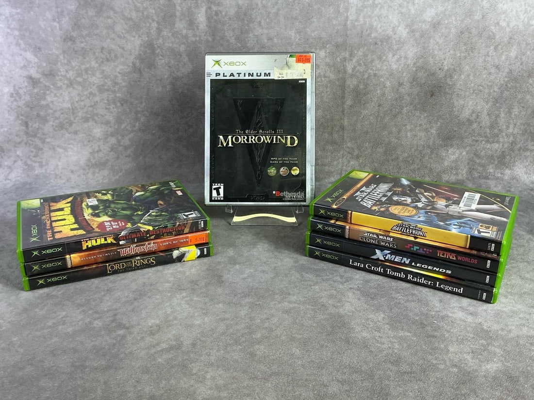 Xbox Games: Eight vintage original Xbox games including The Elder Scrolls, Hulk, Wolfenstein, Lara Croft, and more. All in good untested condition. Each measures 5.25 inches wide x 7.5 inches tall.