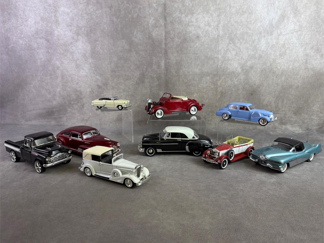 Model Cars: Nine model cars depicting vintage makes and models. All in fair to good condition, one has broken windshield wipers. Largest measures 3 inches wide x 8.25 inches tall.
