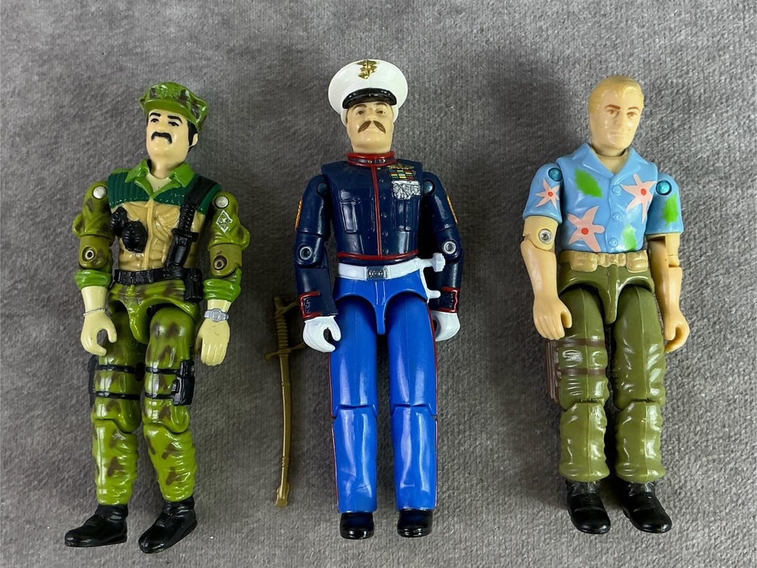 GI Joe Figures: Three 1980s GI Joe figures including Chuckles, Leatherneck, and Gung Ho with sword. All in good condition with tight joints. Gong Ho measures 1 inch wide x 4 inches tall.