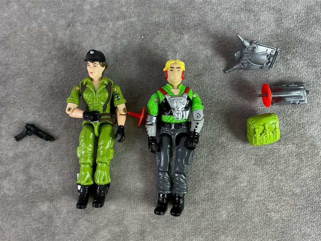 GI Joe Figures: Two 1980s GI Joe figures including Lady Jane with pack and Psyche Out with pack, pistol, receiver, and field projector. All in fair to good condition with Lady Jane’s torso loose. Each measures 1