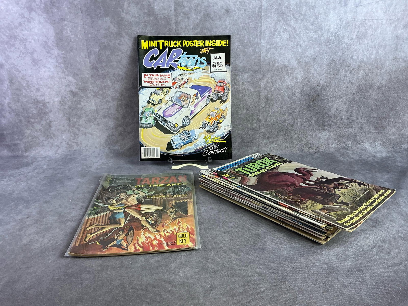 Vintage Comics: Eighteen 1980s comics including Tarzan, Turok, Godzilla, and more. All in fair to good condition. Largest measures 8 inches wide x 10.5 inches tall.