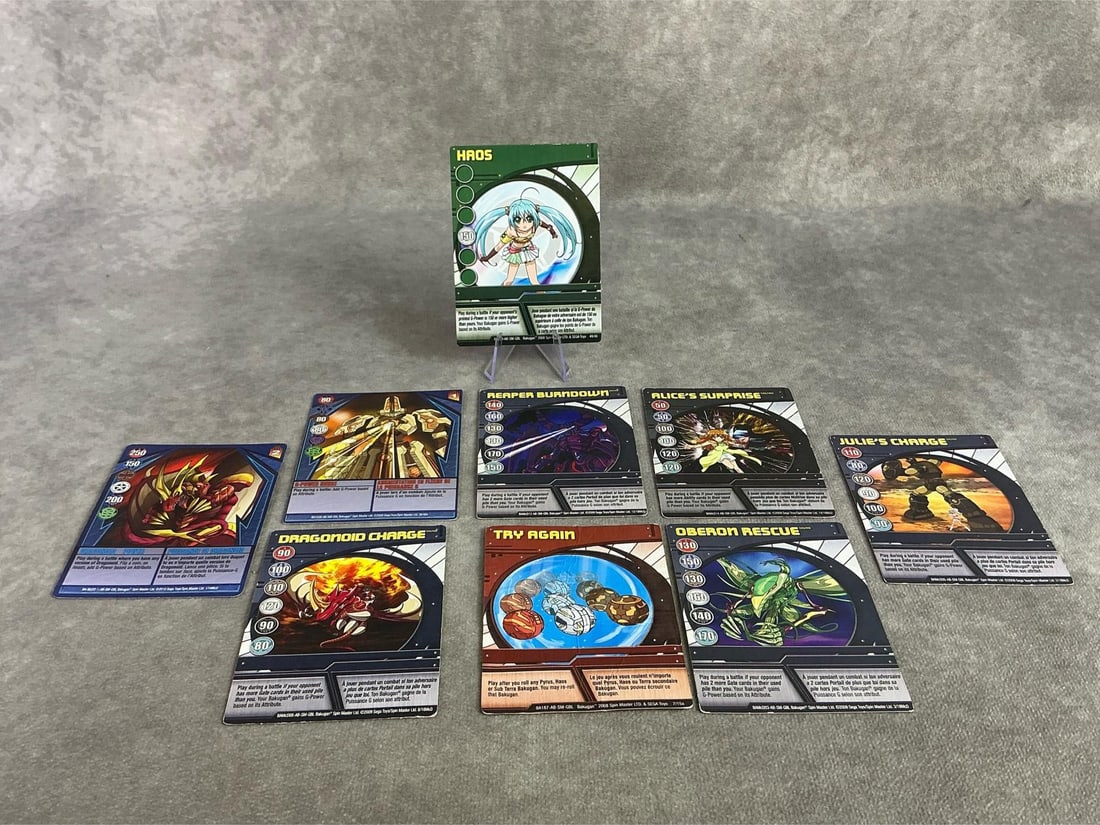 Bakugan Cards: Seventeen 2006 through 2009 Bakugan cards. All in fair to good condition. Each measures 2.5 inches wide x 3.75 inches tall.