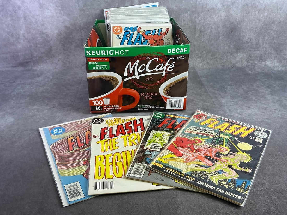 Vintage Comics: Approximately 35 vintage comics including Flash, Darkworld, Superman, and more. All in good condition and with plastic sleeve protectors. Box measures 9.75 inches wide x 12 inches x 7 inches tall.