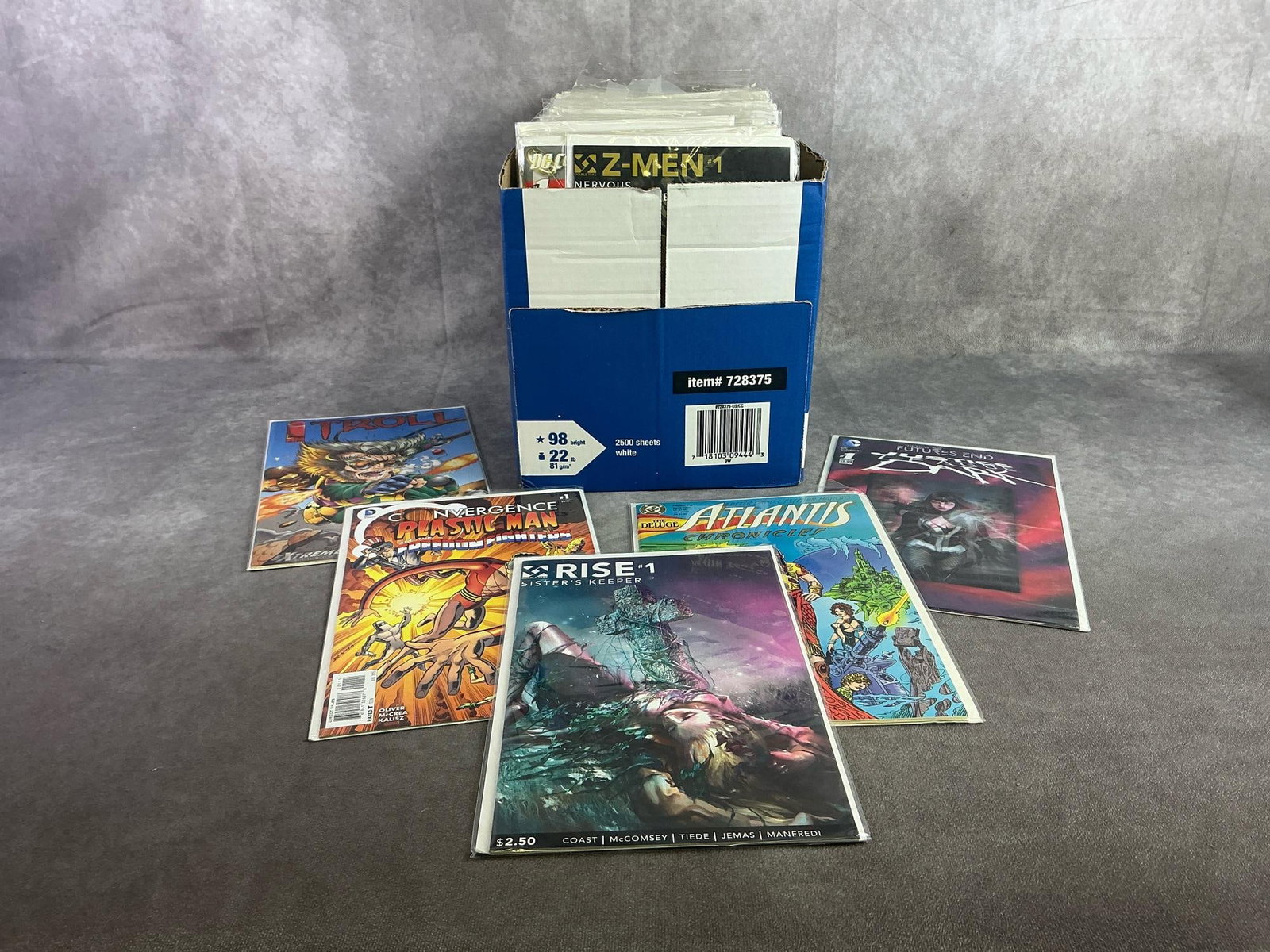 Vintage Comics: Approximately 80 vintage comics including Justice League, Troll, Plastic Man, and more. All in good condition and with plastic sleeve protectors. Box measures 9.75 inches wide x 12 inches x 7 inches