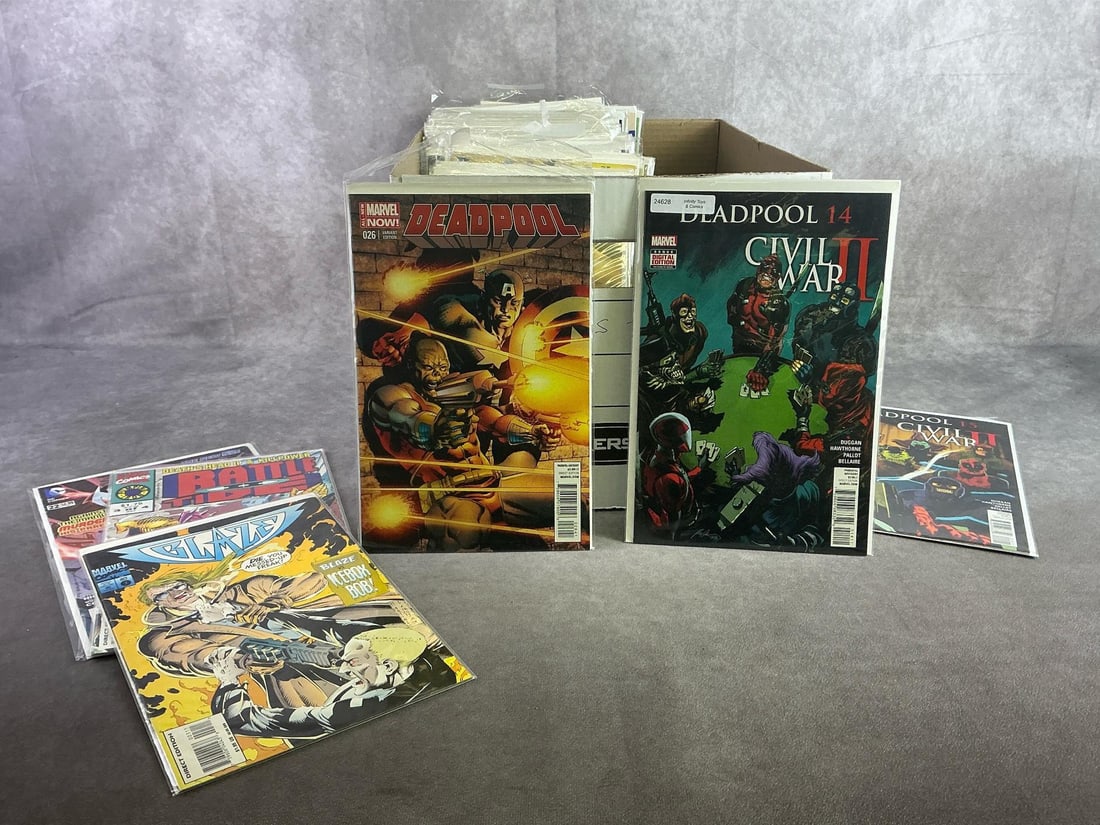 Vintage Comics: Approximately 80 vintage comics including Deadpool, Ironman, Blaze, and more. All in good condition and with plastic sleeve protectors. Box measures 12 inches wide x 15 inches x 10.25 inches tall.