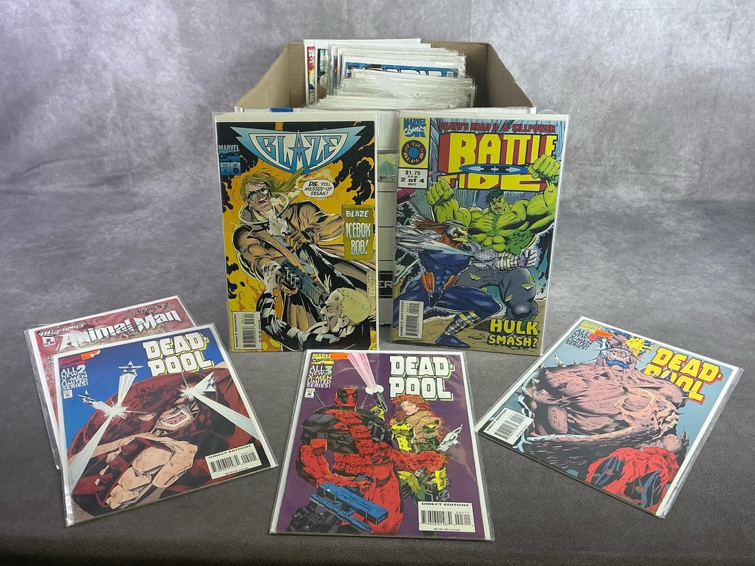 Vintage Comics: Approximately 80 vintage comics including Deadpool, Ironman, Blaze, and more. All in good condition and with plastic sleeve protectors. Box measures 12 inches wide x 15 inches x 10.25 inches tall.