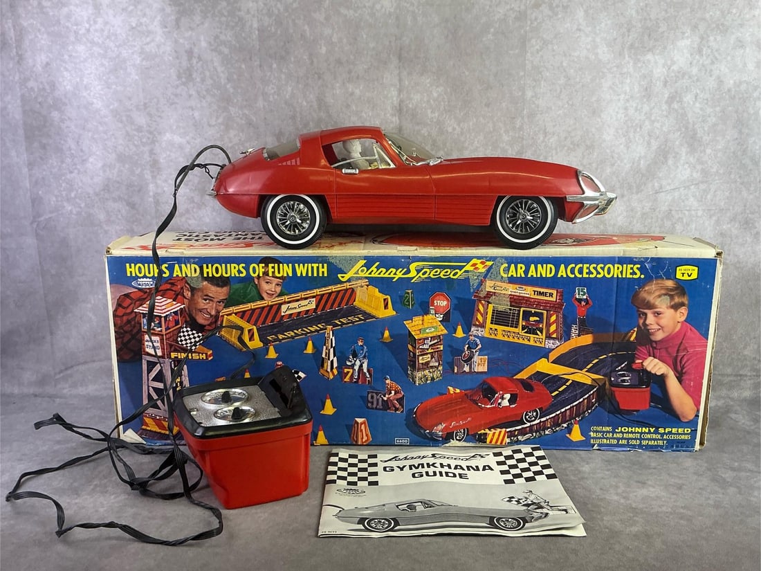 Johnny Speed: 1965 Johnny Speed by Topper Toys, features a sleek 21 inch plastic body and comes with a tethered, wired remote control. In fair condition with original box and untested. Car measures 8.5 inches wide