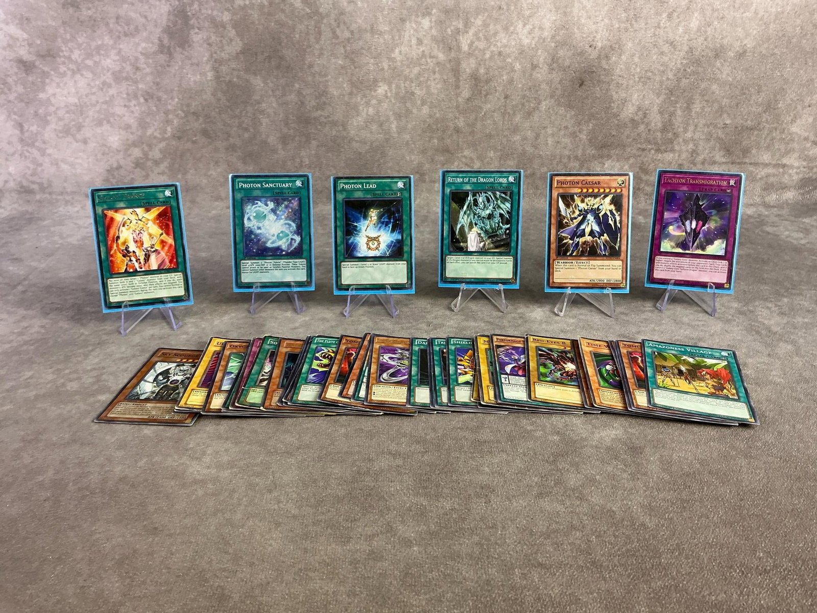 Vintage Yu Gi Oh Cards: Fourty five Yu Gi Oh cards from 1996 and one from 2020. Includes several 1st editions. All in fair to good condition with six in sleeve protectors and each measures 2.5 inches wide x 3.25 inches tall.