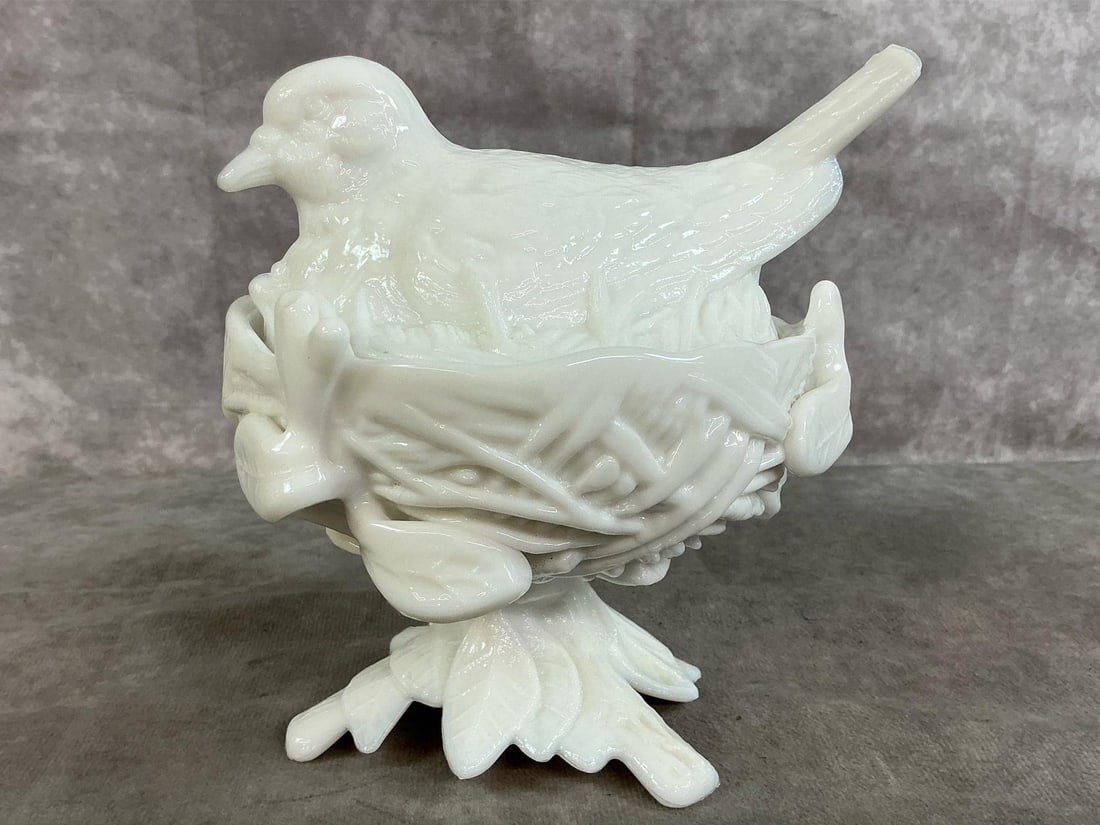 Robin on Nest: 1940's Westmoreland Robin on Nest candy dish. Milk glass with textured nest on footed base. Westmoreland stamp on bottom. In good condition. Measures 6 inches wide x 5 x 6 inches tall.