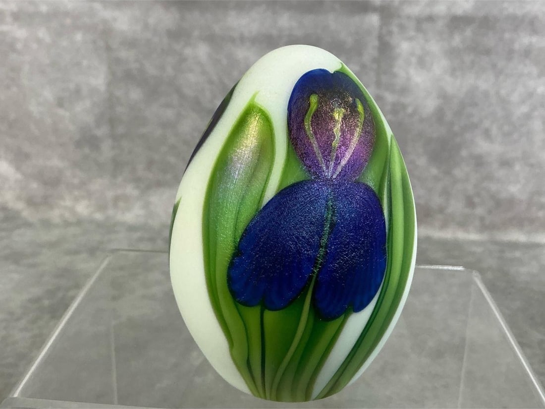Iris by Orient & Flume: Vintage handpainted Iris paperweight. Purple, green, and white art glass by Orient and Flume. In good condition. Measures 2.25 inches in diameter x 3 inches tall.