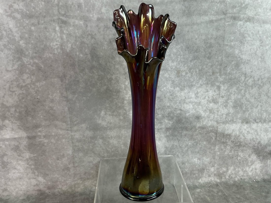 Carnival Swung Glass Vase: Mid 1900's fluted iridescent vase. Carnival purple and blue swung vase with ruffled edge. Possibly Fenton. In good condition. Measures 3.25 inches in diameter x 13 inches tall.