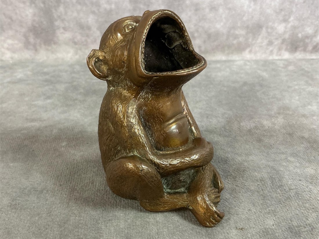 Jennings Brothers Monkey Ashtray: 1920's cast brass metal monkey. Cigar holder/ ashtray marked #1979 by JB (Jennings Bothers Metal Foundry). In good condition. Measures 2.5 inches wide x 2.5 x 3.5 inches tall.