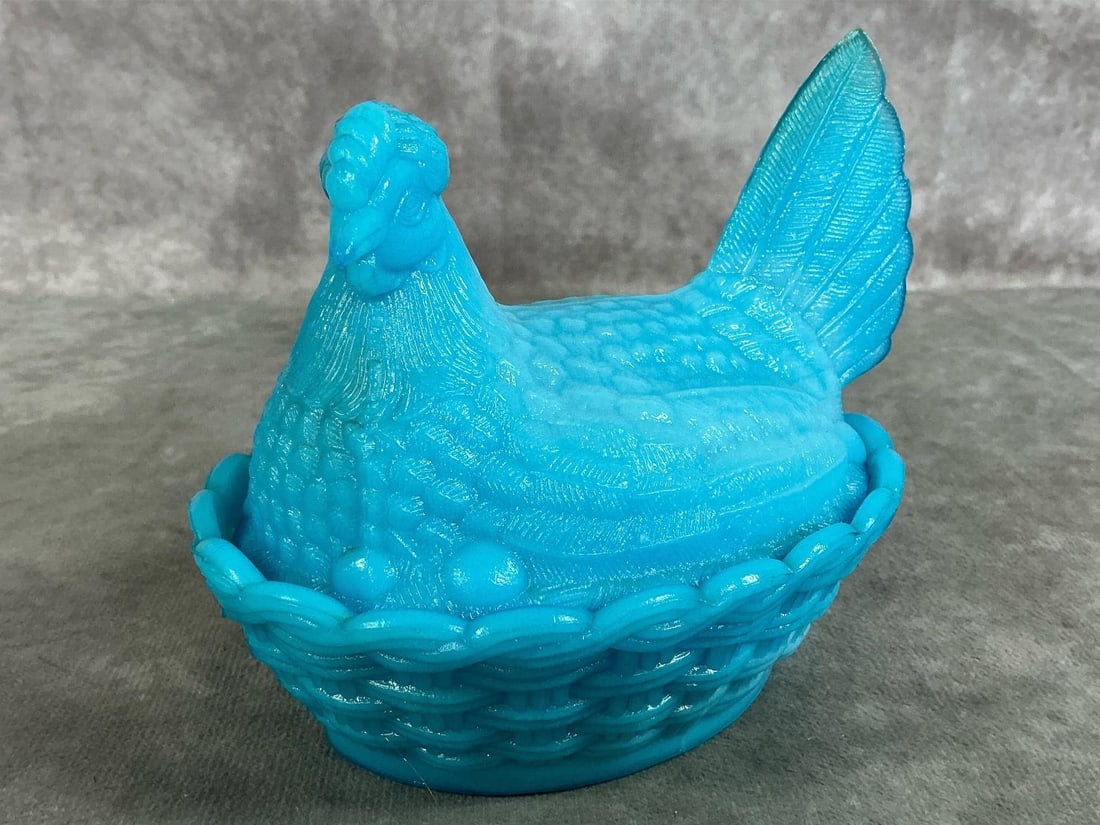 Hen On Nest: Vintage aqua blue hen on a basket. Westmoreland glass sitting hen on "nest" base dish. In good condition. Measures 5 inches long x 4 x 4.25 inches tall.