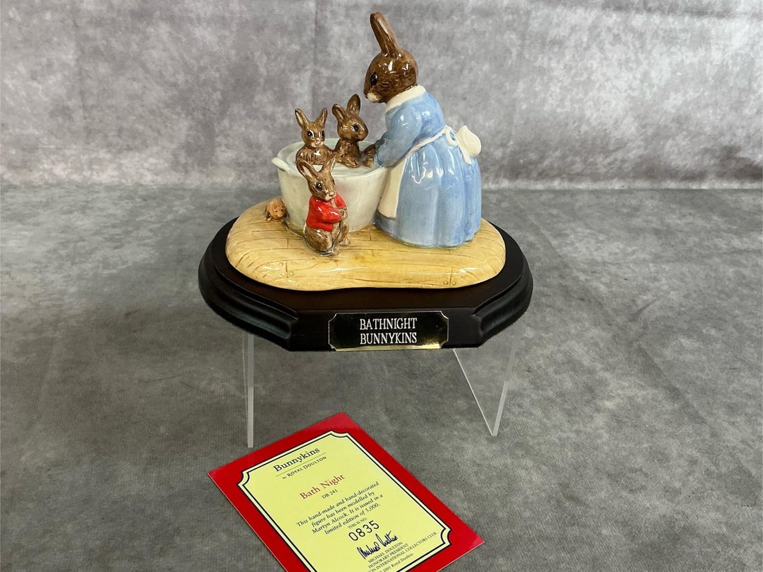 Bunnykins "Bath Night": 2001 Royal Doulton Bunnykins "Bath Night". Hand made and decorated bunny figures by Martin Alcock on a wooden display stand. Marked 835/ 5000, DB 241. In good condition. Measures 6 inches wide x 4.5