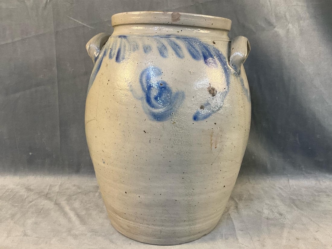 Stoneware Decorated Crock: Mid-19th century floral cobalt decorated stoneware four gallon marked crock with tooled shoulder, squared rim and lug handles. Probably Baltimore or Southeastern Pennsylvania. Chip to rim with two