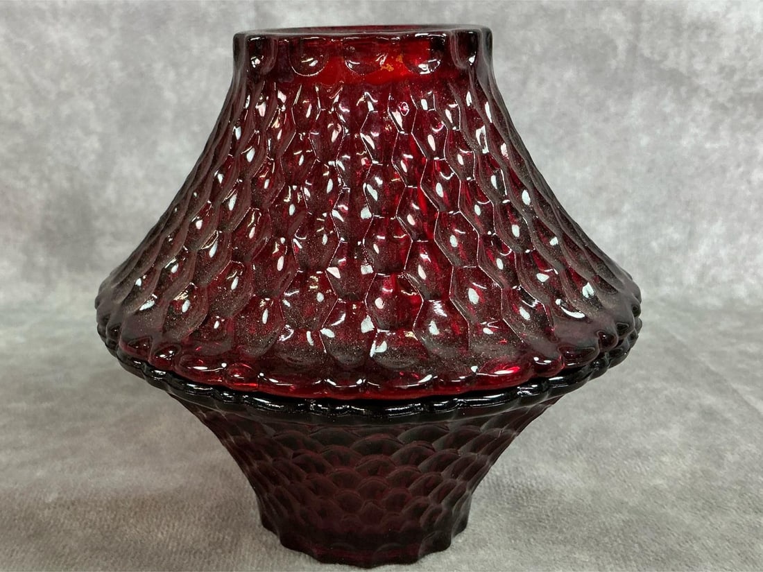 Ruby Red Fairy Lamp: Vintage Indiana Glass fairy lamp. Two piece ruby red with honeycomb pagoda pattern. Small spot of color loss at rim, otherwise in good condition. Measures 5 inches wide x 5 inches tall.