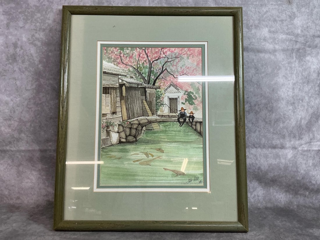 P Buckley Moss "Fishermen": 1988 lithograph by P Buckley Moss. Adult and child fishing from bridge, numbered 163/1000. In green wooden frame with faded matting. Picture in good condition. Measures 15.5 inches wide x 1 x 18.75