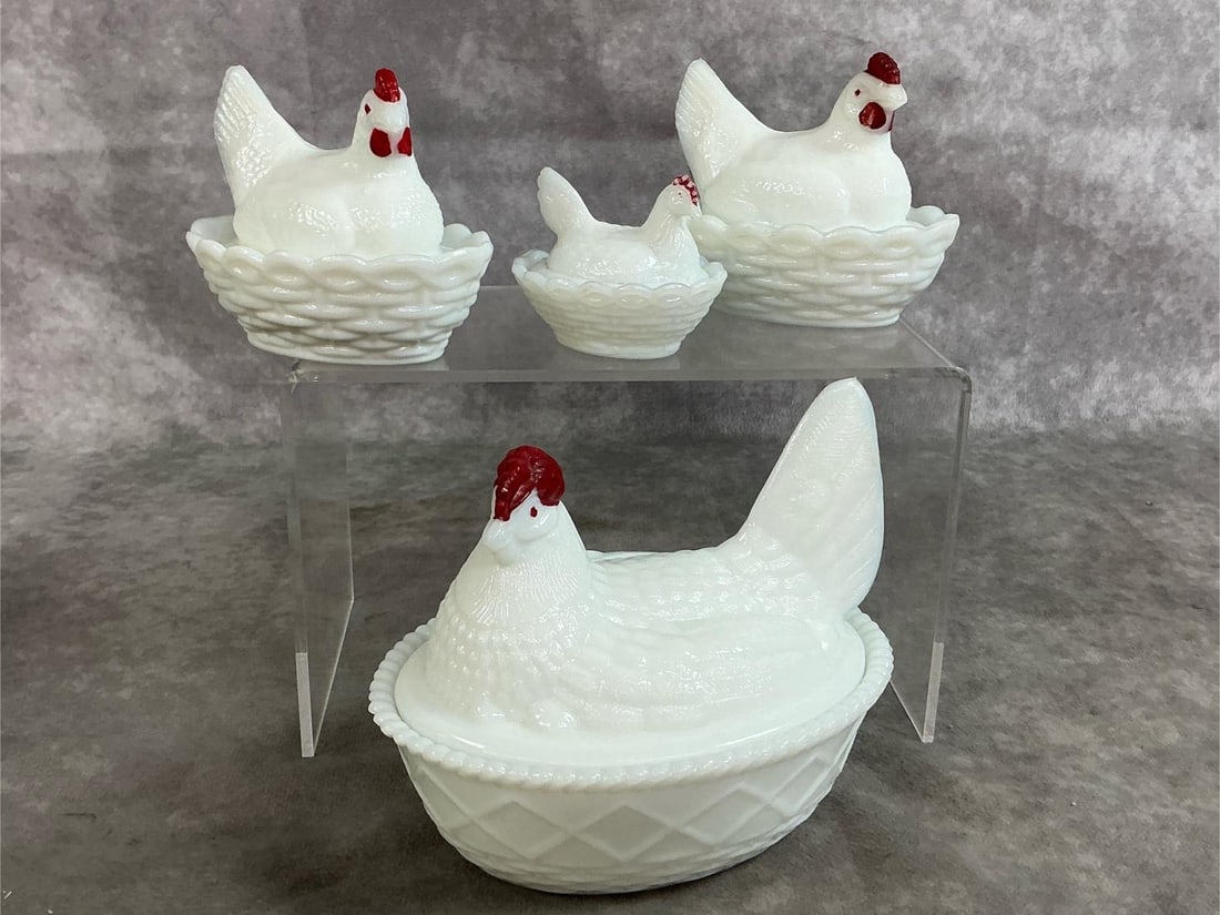 Hens on Nests: Four mid 1900's hens on nests. Westmoreland milk glass hens with red eyes and combs on basket weave base. Smallest has slight paint loss, otherwise all in good condition. Largest measures 5.5 inches