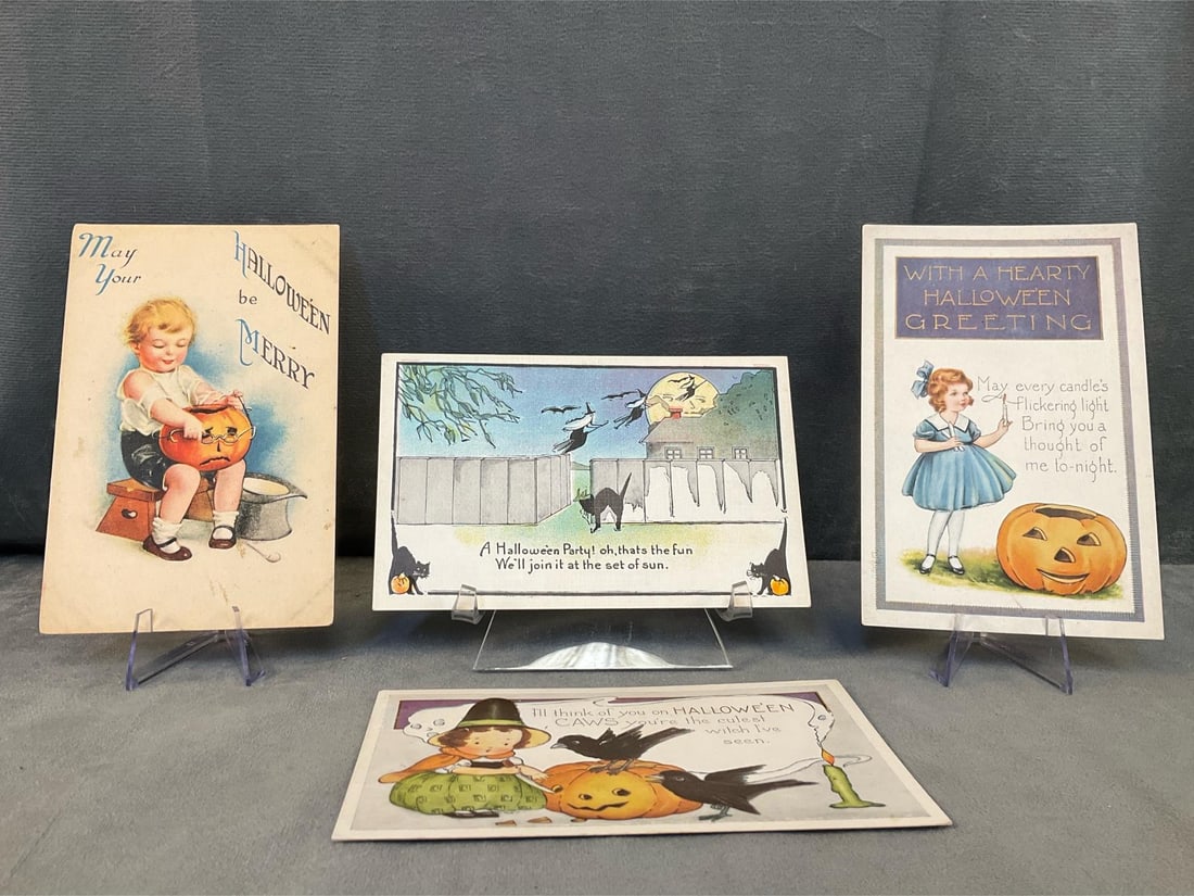 Halloween Postcards: Four early 20th century Halloween postcards including two Whitney postcards. Good used condition . Measures 5.5 inches wide x 3.5 inches tall.